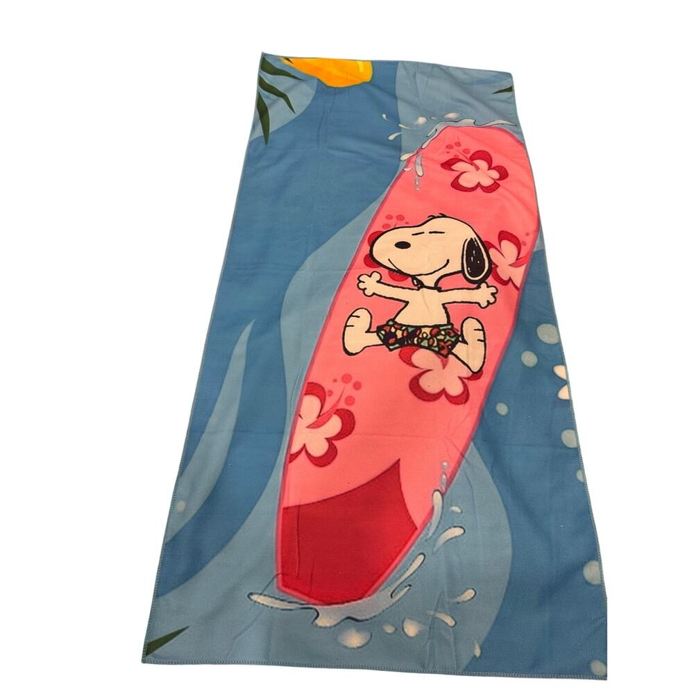 Snoopy on a surfboard beach towel